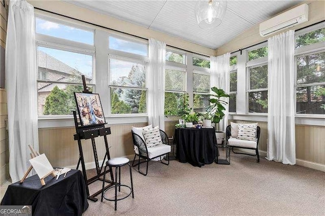 sunroom / solarium featuring lofted ceiling and an AC wall unit