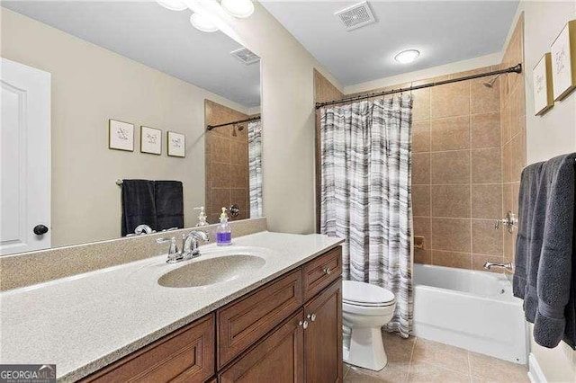 bathroom with tile patterned flooring, visible vents, toilet, shower / bath combination with curtain, and vanity