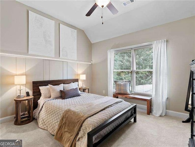 bedroom featuring visible vents, a ceiling fan, baseboards, carpet, and lofted ceiling