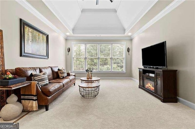 living area with crown molding, carpet, and baseboards