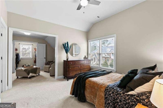 bedroom with multiple windows, lofted ceiling, light colored carpet, and ceiling fan