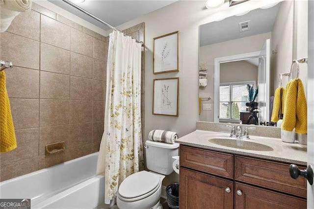 full bathroom featuring visible vents, toilet, vanity, and shower / bath combination with curtain