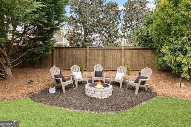 view of patio / terrace with fence and a fire pit