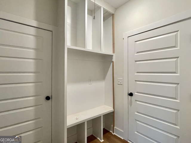 mudroom featuring dark wood-style floors