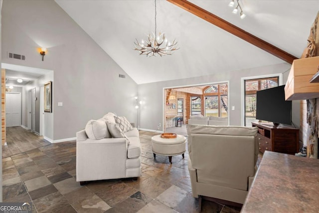 living room featuring visible vents, baseboards, beam ceiling, a notable chandelier, and high vaulted ceiling