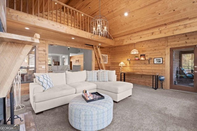 living area featuring high vaulted ceiling, wooden walls, an inviting chandelier, wooden ceiling, and carpet flooring