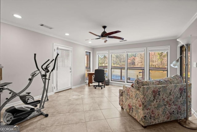 workout room featuring ceiling fan, visible vents, and ornamental molding