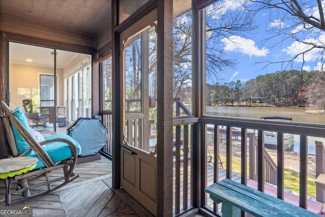 sunroom with a water view