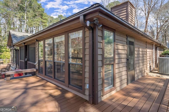 wooden deck with central AC unit