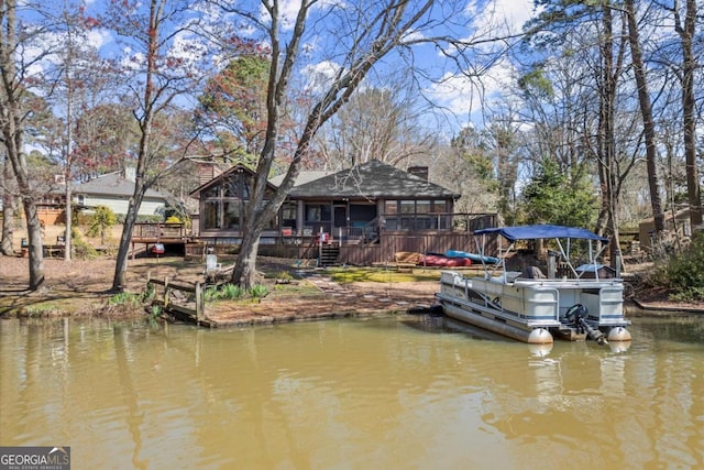 view of dock featuring a deck with water view