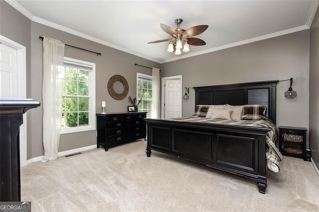 bedroom featuring crown molding, light colored carpet, baseboards, and visible vents