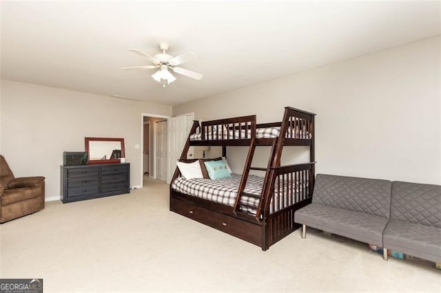 bedroom featuring ceiling fan and carpet