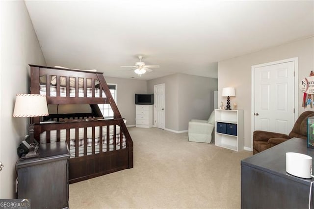 carpeted bedroom featuring baseboards