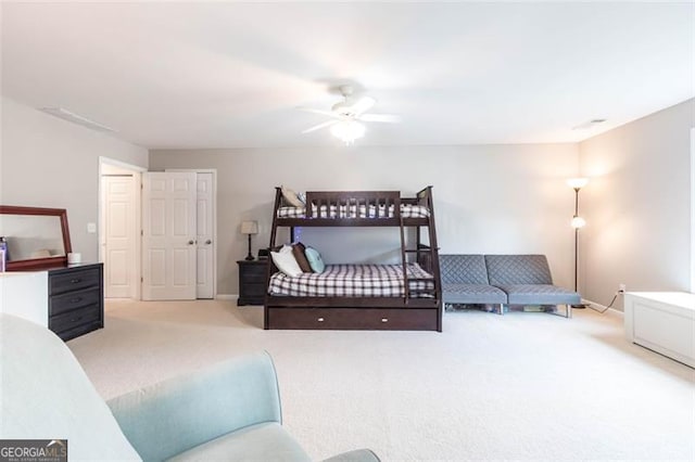 bedroom featuring baseboards, a ceiling fan, and carpet floors