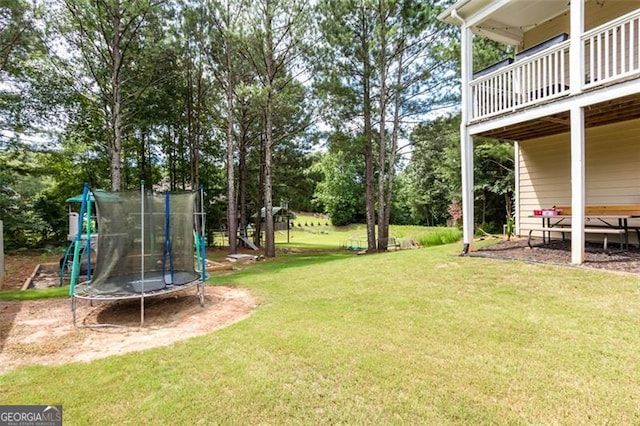 view of yard with a trampoline