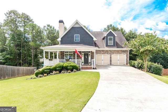 view of front of home featuring a front lawn, a porch, fence, concrete driveway, and a chimney