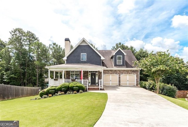 view of front of house featuring a front yard, fence, a porch, a chimney, and concrete driveway