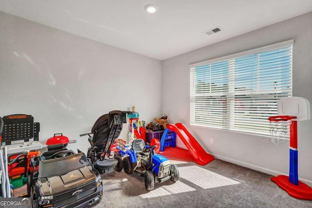 playroom featuring carpet, visible vents, and baseboards