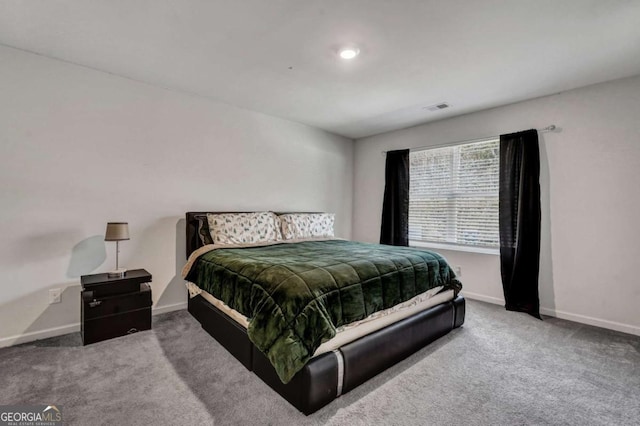 bedroom featuring visible vents, baseboards, and carpet floors