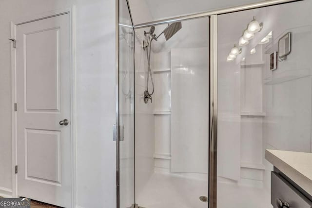 full bathroom featuring a stall shower and vanity