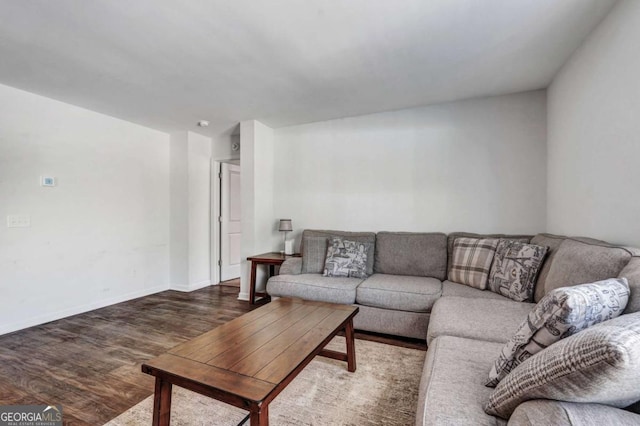 living room featuring baseboards and wood finished floors