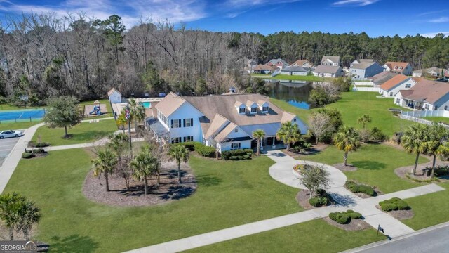 aerial view with a residential view and a view of trees