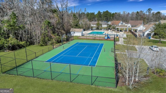 view of tennis court with fence