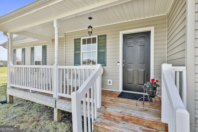 doorway to property with a porch