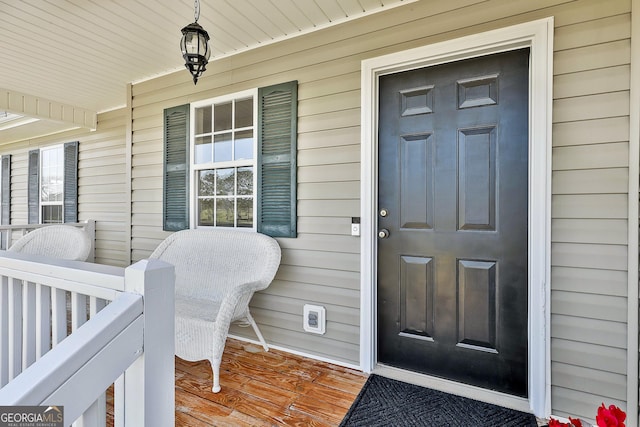 view of exterior entry featuring a porch