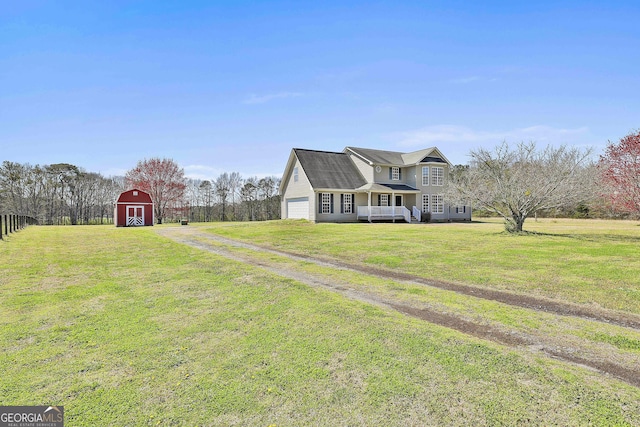 view of property exterior featuring an outbuilding, a barn, driveway, and a lawn