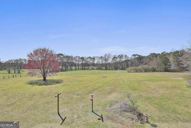 view of yard with a rural view