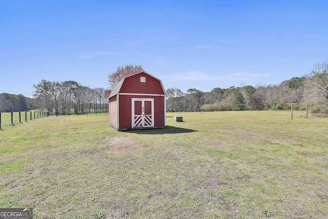 view of barn featuring a yard