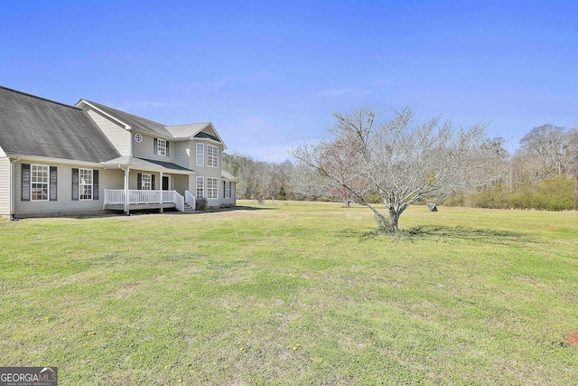 view of yard featuring a wooden deck