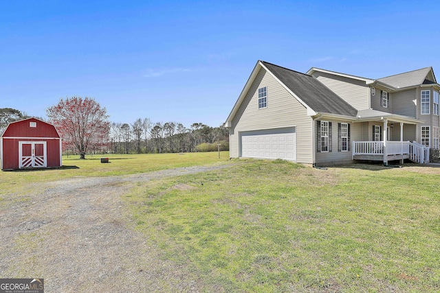 view of property exterior featuring a barn, a porch, a yard, an outbuilding, and driveway