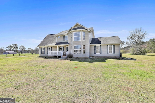 traditional-style home featuring a front yard and crawl space