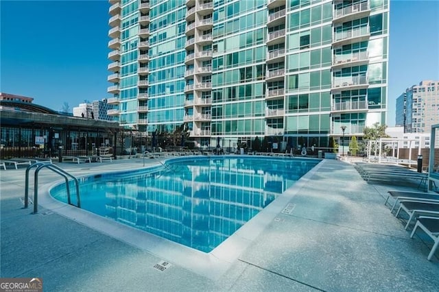community pool featuring a city view