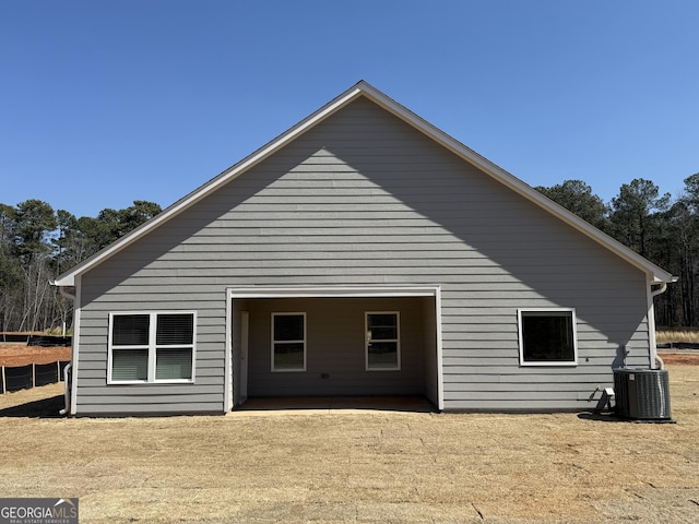 back of house with cooling unit