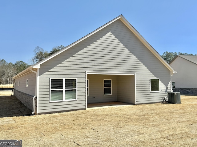 back of property with central AC unit