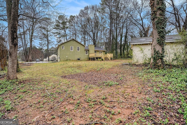 view of yard featuring a wooden deck