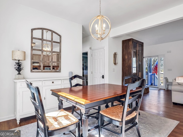 dining space featuring a chandelier and dark wood-style flooring