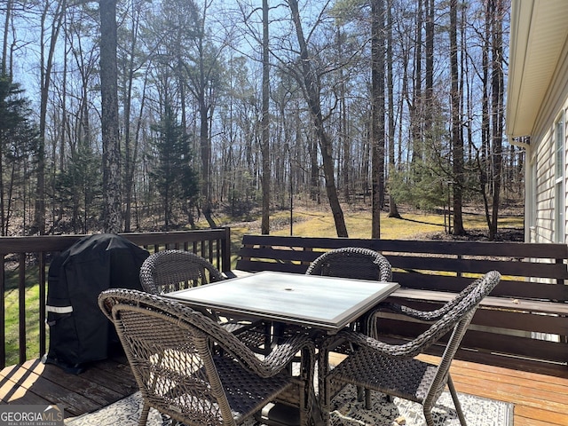 deck with outdoor dining space