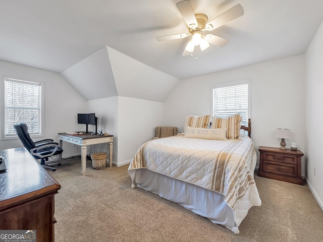 bedroom with multiple windows, carpet, and vaulted ceiling