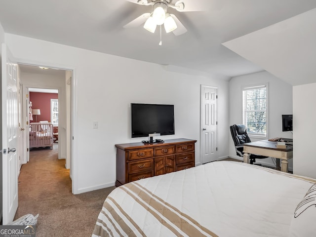 carpeted bedroom with a ceiling fan and baseboards