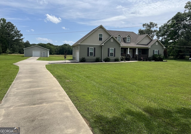 18 Vernon Rd NE, Rome, GA 30165 - craftsman house with covered porch, a detached garage, a front lawn, concrete driveway, and an outbuilding
