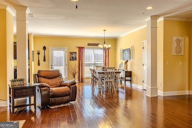 18 Vernon Rd NE, Rome, GA 30165 - dining room with decorative columns, dark wood finished floors, baseboards, crown molding, and a chandelier