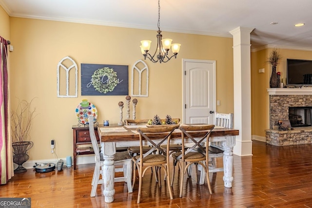 18 Vernon Rd NE, Rome, GA 30165 - dining space with wood finished floors, ornamental molding, baseboards, a chandelier, and a stone fireplace