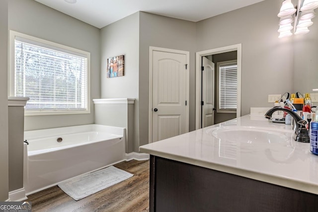 18 Vernon Rd NE, Rome, GA 30165 - full bathroom with wood finished floors, a bath, and vanity