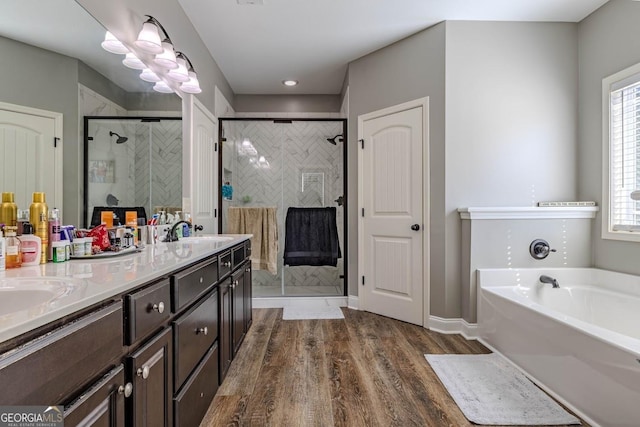 18 Vernon Rd NE, Rome, GA 30165 - full bathroom featuring healthy amount of natural light, a stall shower, a garden tub, and double vanity