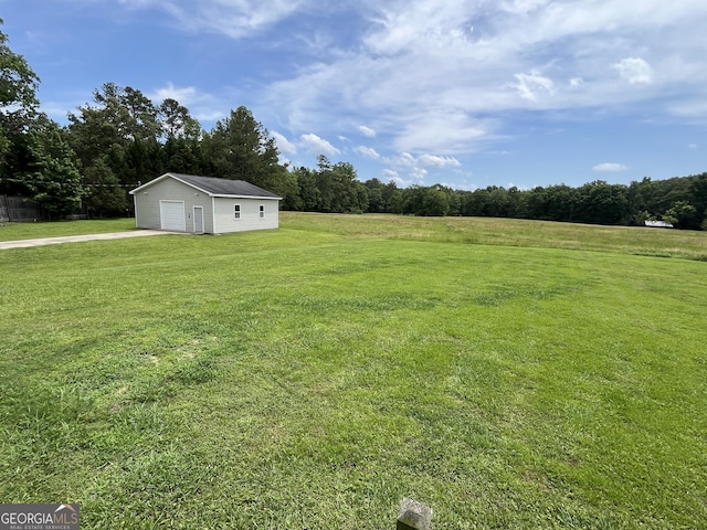 18 Vernon Rd NE, Rome, GA 30165 - view of grassy yard with an outbuilding, a garage, and driveway
