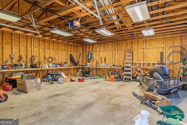 18 Vernon Rd NE, Rome, GA 30165 - garage featuring a workshop area and a garage door opener